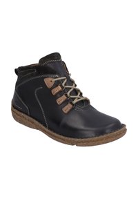 Musta nahkainen nilkkakengät ruskeilla yksityiskohdilla, nauhakiinnitys, teksturoitu samettikaulus ja luonnollisen näköinen pohja.