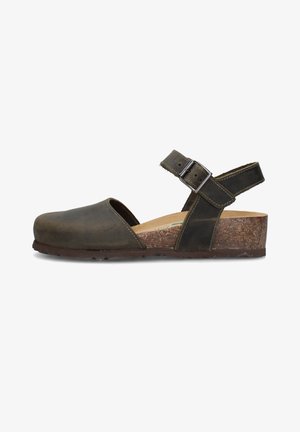 Sandalo in pelle marrone scuro con retro aperto, punta chiusa, cinturino regolabile alla caviglia con fibbia metallica e suola con zeppa in sughero.