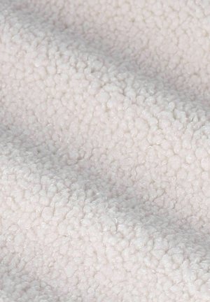 Helle Fleece-Stoff mit einer weichen, strukturierten und flauschigen Oberfläche, die ein gleichmäßiges, delliges Muster aufweist.