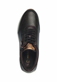 Black sneaker with perforated design, bronze accents, lace-up front, and side zipper. Features a cushioned interior and rounded toe.