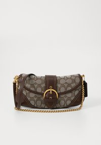 Brown and beige patterned shoulder bag with gold chain strap, leather buckle strap, and rounded flap closure on a white background.