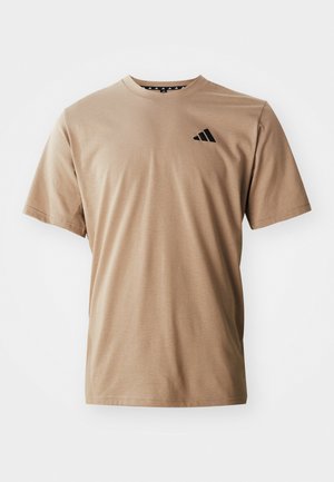 Beige short-sleeve T-shirt made of cotton, featuring a classic crew neck and a black logo detail on the left chest. Soft texture.
