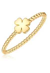 Arany színű karkötő, csavart szalagszerkezettel, a középpontjában egy kiemelkedő négylevelű lóhere charm-mal.