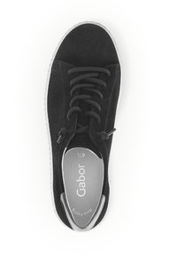 Black suede sneaker with round toe, lace-up design, and grey rubber sole. Interior features logo and cushioned insole for comfort.