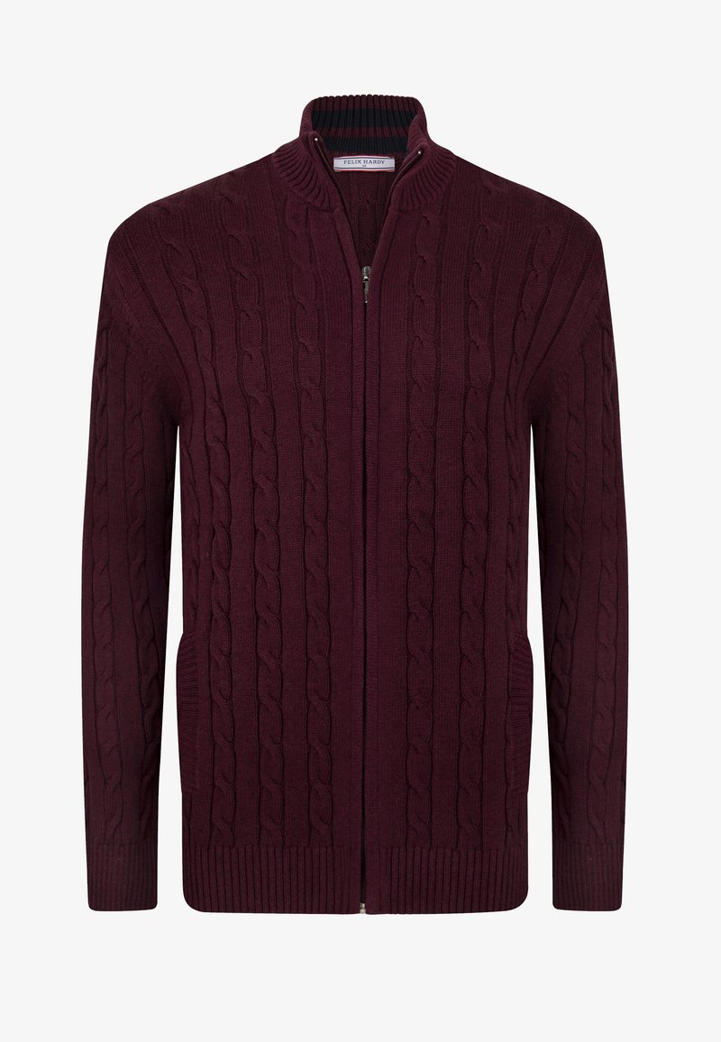 Cardigan lavorato a maglia color marrone con collo alto, chiusura con zip, motivo a treccia, polsini a costine e tasche laterali. Realizzato in tessuto morbido e strutturato.