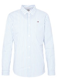 Camicia bianca a maniche lunghe con righe verticali blu, colletto button-down e un piccolo logo sul petto. Realizzata in un tessuto a trama liscia.