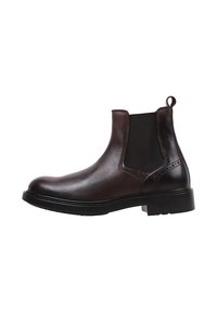 Bottines Chelsea en cuir marron avec des panneaux élastiques sur les côtés, bout rond, lanière de tirage et semelle épaisse en caoutchouc noir. Surface plate et texturée.