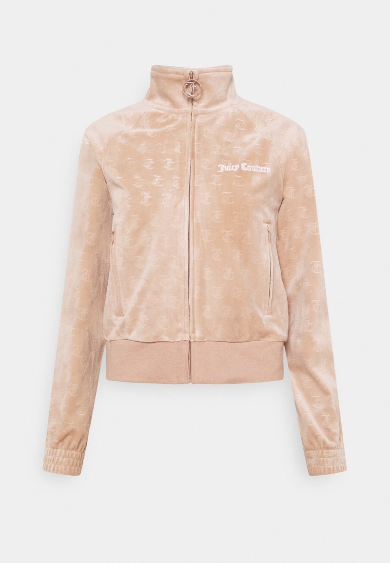 Rosa sammet zip-up-jacka med hög krage, med ett mönster av logotyper över hela. Framficka med dragkedja. Elastiska ärmslut och nederkant.