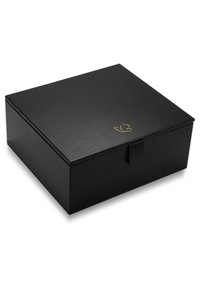 Black rectangular box with a textured surface, featuring a gold leaf logo, a front flap closure, and no visible hardware.