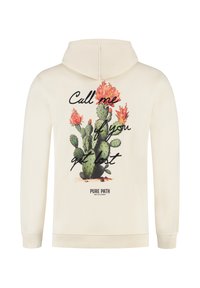 Hoodie in lichtcrème, met een cactusafbeelding en de tekst "Bel me als je verdwaald bent." Merknnaam "PURE PATH" weergegeven eronder.