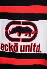 Black, white, and red striped cotton T-shirt featuring an embroidered logo with a rhino silhouette and the text "eckō unltd." in bold letters.
