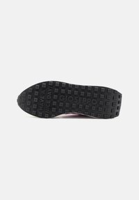 Black rubber sole with textured pattern. Features embossed text: "HAVE A NICE DAY!" and "GIOSEPPO." Overall rounded and flat shape.