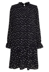 Svart långärmad klänning med vita prickar, plisserad tyg, volangkrage och samlade muddar. Flödande silhuett, knälång design.