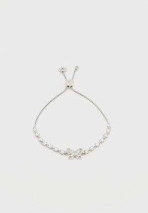 Sølv justerbart armbånd med klare rhinestones og et sommerfuglfomet midtstykke dekorert med små krystaller.