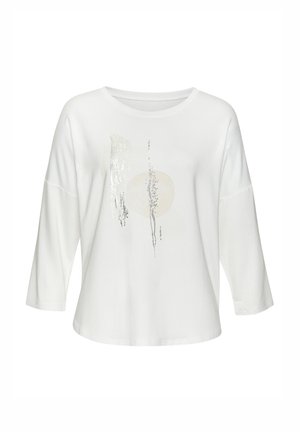 White long-sleeve shirt with a loose fit, featuring a front design of silver sequins and a circular beige accent. Soft fabric texture.