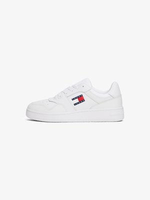 White sneakers with a smooth leather finish, featuring a side logo in red, white, and navy stripes, and a textured rubber sole.