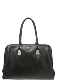 Sac à main en cuir noir avec double anses, quincaillerie en argent, fermeture zippée et détail de logo à l'avant. Texture lisse, design structuré.