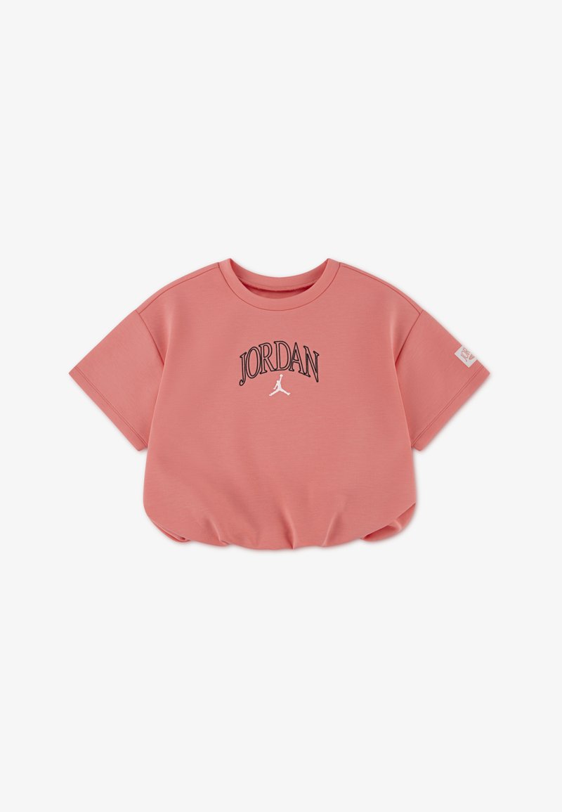 Ροζ κοντομάνικο τοπ φτιαγμένο από απαλό ύφασμα. Διαθέτει το λογότυπο «JORDAN» και σχέδιο σιλουέτας σε μαύρο. Κοντά μανίκια με στρογγυλή λαιμόκοψη.