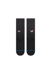 Black socks with a textured pattern, featuring orange eyes embroidered on the front and a blue accent at the toe and ankle.