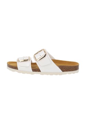 White two-strap sandals with gold buckles, cork footbed, and textured white outsole. The straps are smooth with adjustable closures.
