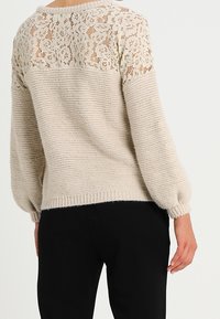 NAF NAF Stickad tröja - beige