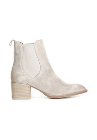 Stivaletto in camoscio beige chiaro con punta rotonda, pannelli laterali elastici e tacco a blocco rigato. Presenta una linguetta sul retro.