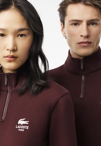 Lacoste Felpa - bordeaux bzd