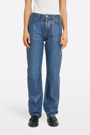 Blue denim jeans with a loose fit, straight legs, five-pocket design, and front button closure. The fabric has subtle fading and stitching details.
