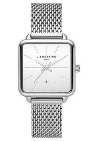 Vierkante zilveren horloge met een witte wijzerplaat, dunne zilveren uurmarkeringen en een datumaanduiding op 6 uur. Voorzien van een metalen mesh band.