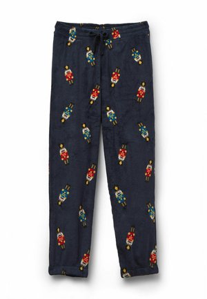 Marineblauwe pyjamabroek van zachte stof met kleurrijke notenkrakerpatronen. Voorzien van een trekkoord in de taille en taps toelopende pijpen voor comfort.