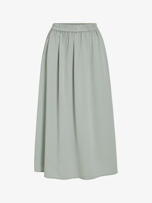 Weit schwingender Midirock aus hellgrünem Stoff mit elastischem Bund und Falten-Design. Glatte Textur und fließende Silhouette.