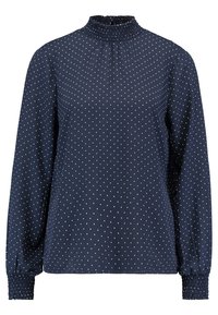 Marinblus med långa ärmar, hög smockad krage och vita prickar. Har en avslappnad passform och smockade manschetter för en texturerad finish.