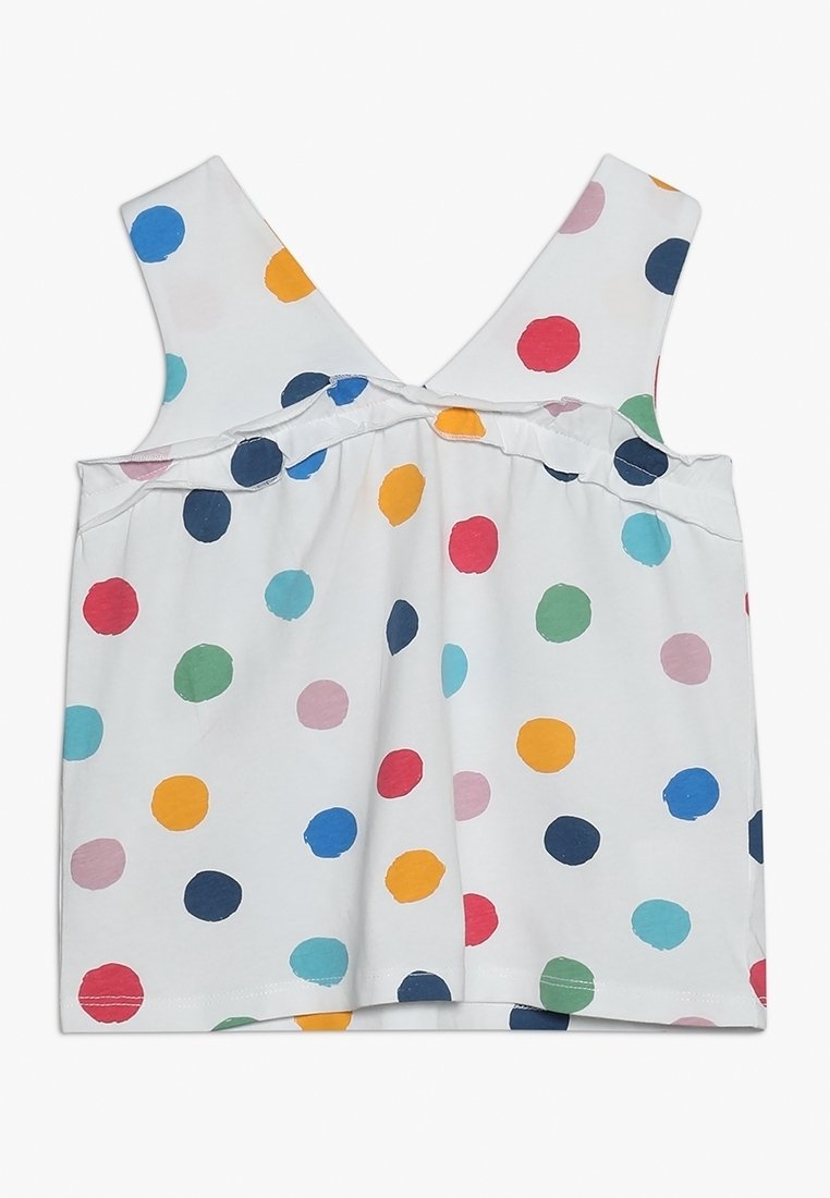 Haut blanc sans manches pour tout-petit avec larges bretelles et pois colorés irréguliers en bleu, vert, rouge, rose, orange et bleu marine.