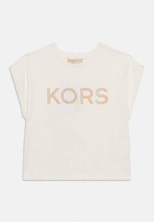 Cream-colored short-sleeve shirt with round neck and "KORS" printed in rose gold dots across the chest.