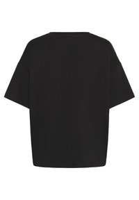 T-shirt nera oversize realizzata in morbido cotone, con scollo rotondo, maniche corte e una vestibilità comoda dal tessuto liscio.