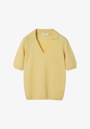 Yellow knit polo shirt with short sleeves, v-neckline, and decorative embroidery on the left side. Soft texture, casual fit.