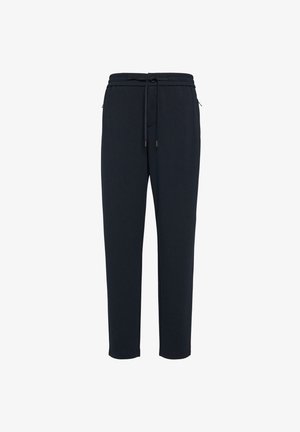 Tumed jogger püksid, mis on valmistatud pehmest kangast, elastse vöökoha ja paeltega, kahe külje tasku ning kitsenevate jalgadega.