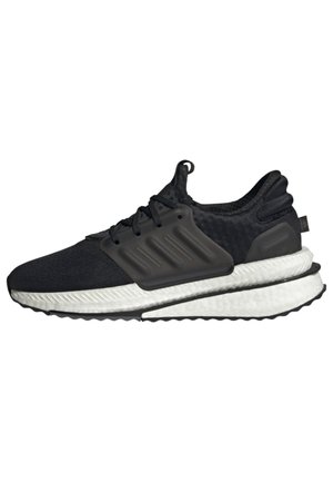 Baskets de sport noires avec semelle blanche amortie, côtés texturés, lacets et languette au talon, vues de profil.