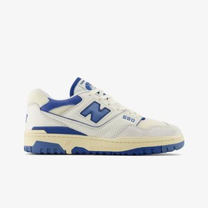 White and blue sneaker with mesh and suede materials, featuring a flat rubber sole and prominent "N" logo on the side.