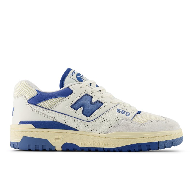 White and blue sneaker with mesh and suede materials, featuring a flat rubber sole and prominent "N" logo on the side.