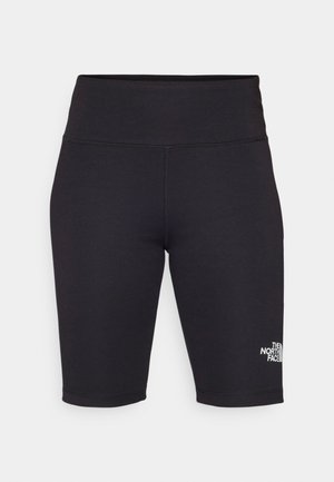 Pantalones cortos de bicicleta negros hechos de tejido elástico, con una cintura alta y un pequeño logo blanco en el lado izquierdo. Textura suave, corte a la altura de la rodilla.