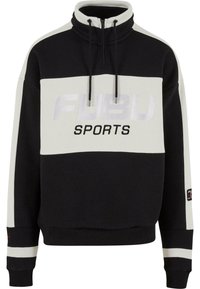Sort og hvid farve-blokeret fleece sweatshirt med høj krave, lynlås lukning, "FUBU SPORTS" logo og kontrasterende stribede manchetter.
