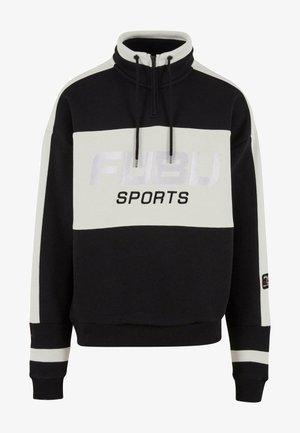 Czarny i biały polarowy sweter z wysokim kołnierzem, zapięciem na zamek, logo "FUBU SPORTS" oraz kontrastowymi paskami na mankietach.