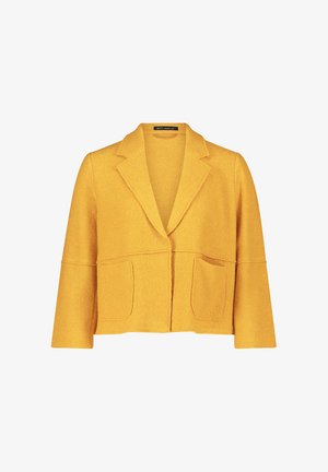 Blazer court jaune en tissu texturé, avec un col cranté, deux poches avant et un design ouvert à l'avant. Doux et léger.