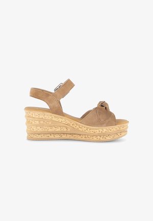 Beige Keilsandalette mit Knöchelriemen, geknotetem Vorderteil und strukturierter Plateausohle.