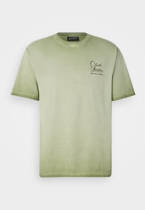 Light green cotton t-shirt with a crew neckline, short sleeves, and embroidered "Club Soda" logo in dark brown on the left chest.