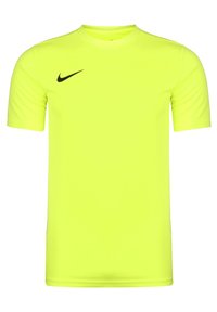 Jasnożółta koszulka z krótkim rękawem wykonana z lekkiego materiału. Posiada czarne logo Nike na lewej piersi. Okrągły dekolt o gładkiej fakturze.