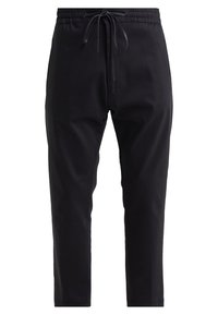 Pantalons de jogging noirs en tissu doux, avec une taille élastique dotée d'un cordon de serrage ajustable et une coupe fuselée. Style minimaliste.