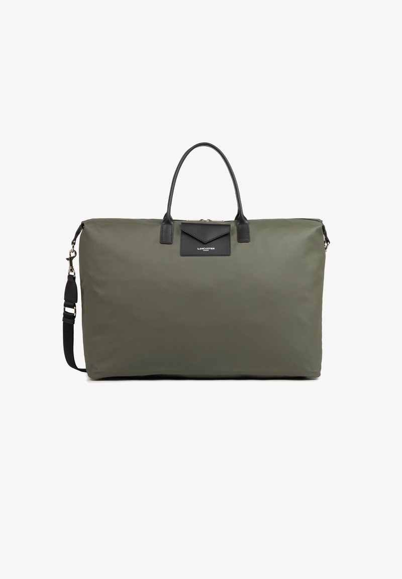 Borsa a sacca in nylon verde oliva con dettagli in pelle nera, doppi manici corti e tracolla removibile. Presenta un logo frontale.