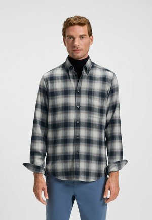 Plaid long-sleeve shirt in gray, white, and navy colors. Soft fabric, button-up design, full sleeves, and a single chest pocket.